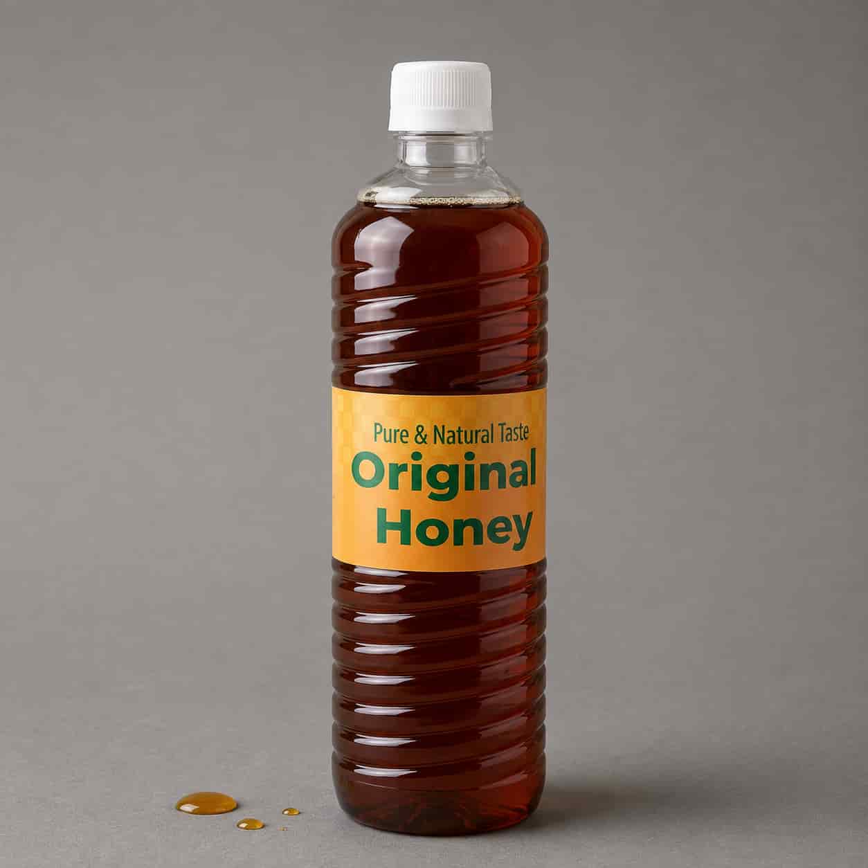 Original honey in a clear plastic bottle with a golden label