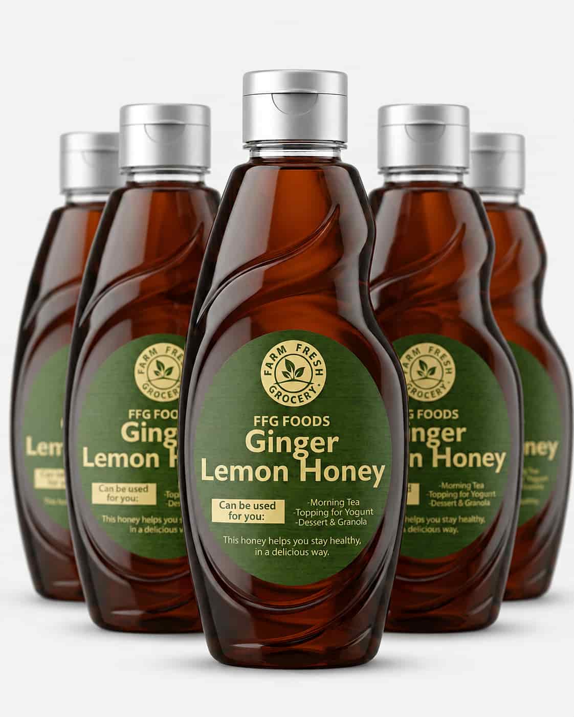Ginger lemon honey in a glass bottle with honey spilling onto a white background