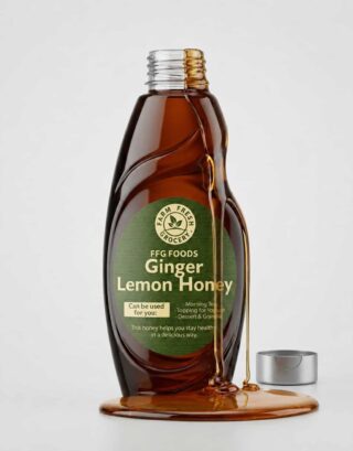 Ginger lemon honey in a glass bottle with honey spilling onto a white background