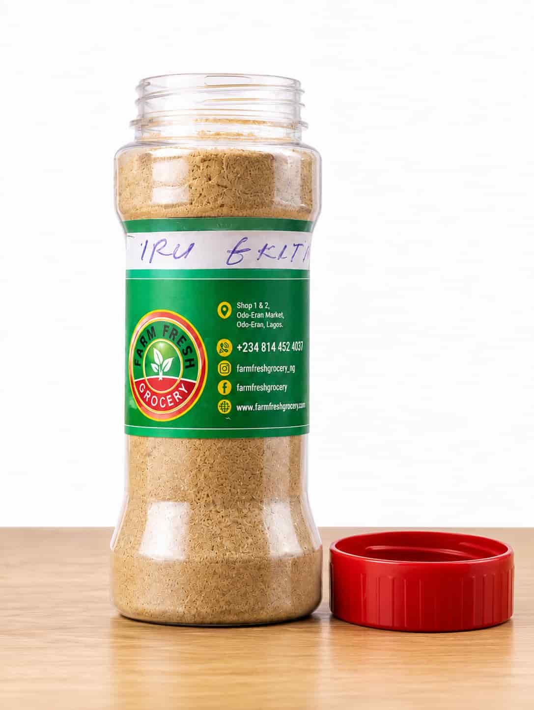 Jar of Iru Ekiti dried ground locust beans powder by Farm Fresh Grocery