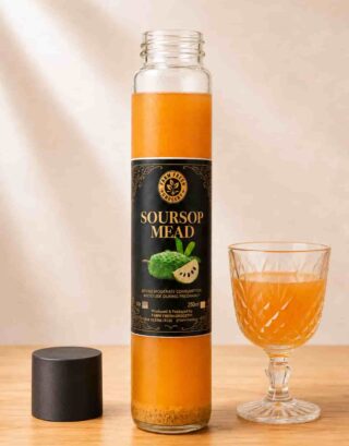Bottle of Farm Fresh Grocery Soursop Mead, a naturally fermented honey wine, served next to a full wine glass
