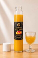 Bottle of Farm Fresh Grocery Mango Mint Mead, a naturally fermented mango and mint honey wine made in Lagos, Nigeria
