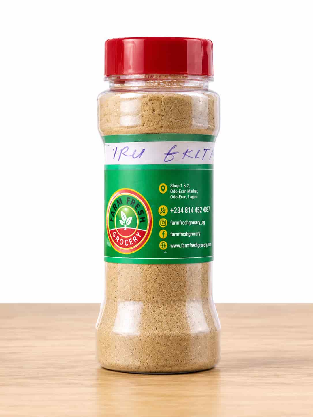 Jar of Iru Ekiti dried ground locust beans powder by Farm Fresh Grocery