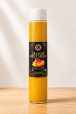 Bottle of Farm Fresh Grocery Mango Mint Mead, a naturally fermented mango and mint honey wine made in Lagos, Nigeria